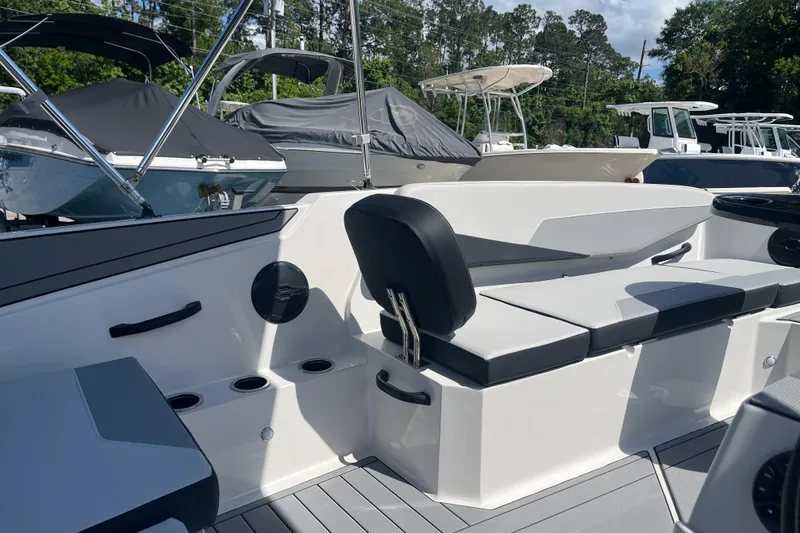 Slide: The Image of 2026 Starcraft SV 16 OB boat interior with seating and cup holders. - 11