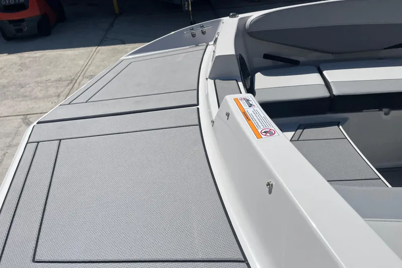 Slide: The Image of 2026 Starcraft SV 16 OB boat interior with gray seating and deck details. - 18