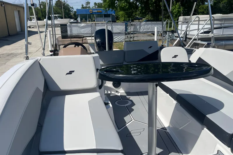Slide: The Image of Interior view of 2026 Starcraft SV 16 OB boat with seating and table. - 20