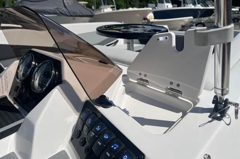Slide: The Image of 2026 Starcraft SV 16 OB boat dashboard with gauges and control panel. - 23