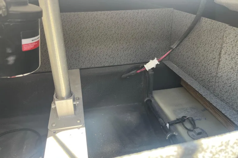 Slide: The Image of Interior view of a 2026 Starcraft SV 16 OB boat, showcasing wiring and structural components. - 27