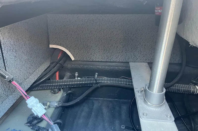 Slide: The Image of Interior view of 2026 Starcraft SV 16 OB boat showing wiring and support structures. - 32