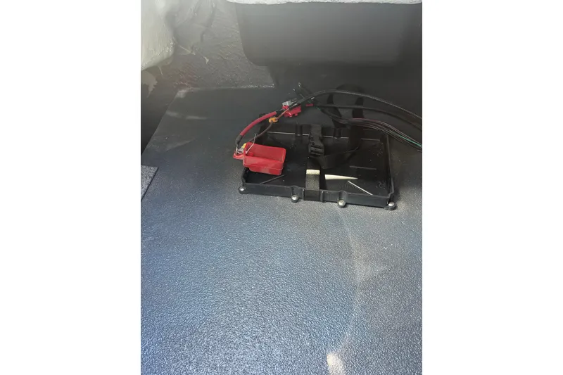 Slide: The Image of Battery compartment of 2026 Starcraft SV 16 OB boat with wiring connections. - 34