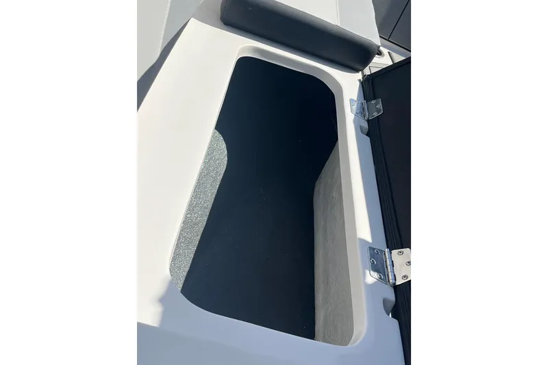 Slide: The Image of Storage compartment of 2026 Starcraft SV 16 OB boat, featuring sleek design and durable hinges. - 37