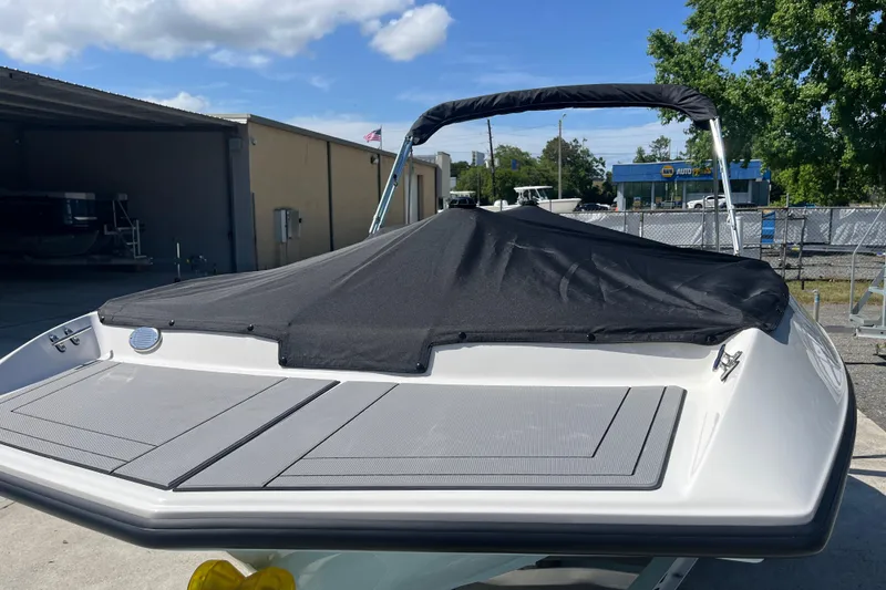 Slide: The Image of 2026 Starcraft SV 16 OB boat with black cover, parked outdoors under a clear sky. - 39