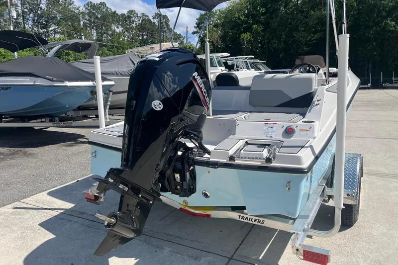 Slide: The Image of 2026 Starcraft SV 16 OB boat with Mercury outboard motor on trailer, parked outdoors. - 7