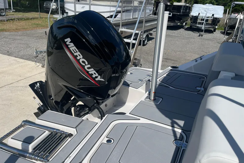 Slide: The Image of 2026 Starcraft SV 16 OB boat with Mercury outboard motor, docked outdoors. - 8