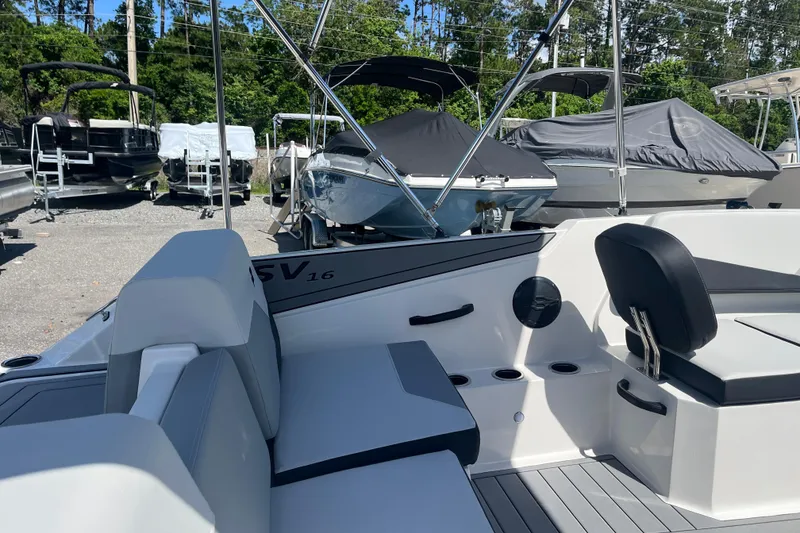Slide: The Image of 2026 Starcraft SV 16 OB boat interior with seating, cup holders, and sleek design. - 9