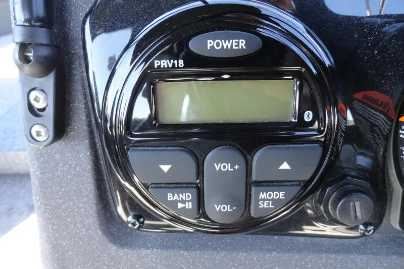 Slide: The Image of Close-up of a 2022 Tracker Targa V-19 Combo boat stereo control panel. - 10