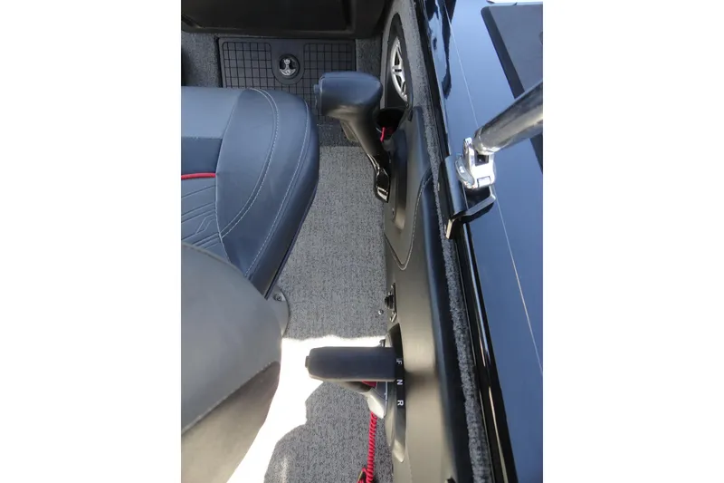Slide: The Image of Interior view of 2022 Tracker Targa V-19 Combo boat controls and seating. - 11