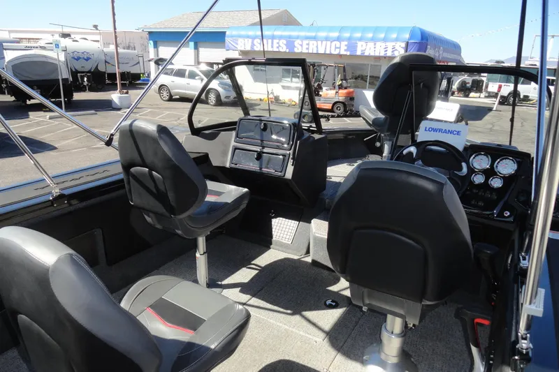 Slide: The Image of Interior of 2022 Tracker Targa V-19 Combo boat with seating and control panel. - 13