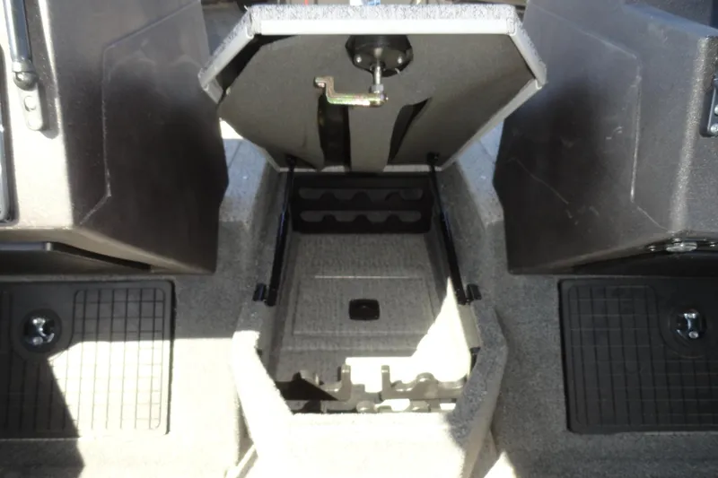 Slide: The Image of 2022 Tracker Targa V-19 Combo boat interior storage compartment open. - 14