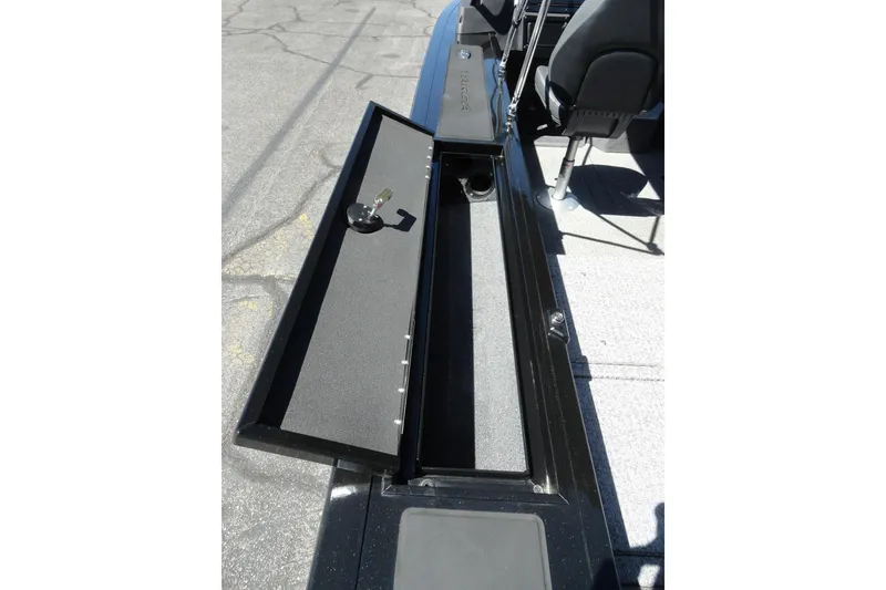 Slide: The Image of 2022 Tracker Targa V-19 Combo boat with open storage compartment. - 15