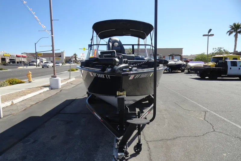 Slide: The Image of 2022 Tracker Targa V-19 Combo boat on trailer in parking lot. - 2