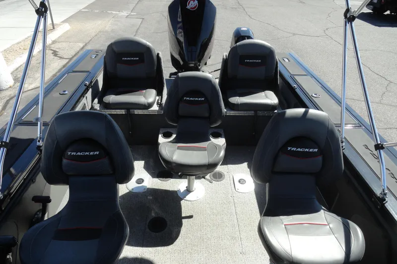 Slide: The Image of 2022 Tracker Targa V-19 Combo boat interior with five seats and modern design. - 23