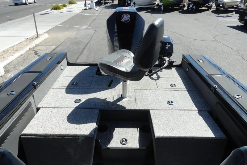 Slide: The Image of 2022 Tracker Targa V-19 Combo boat interior with seating and storage compartments. - 24