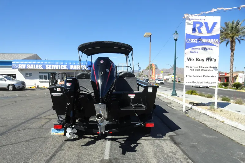 Slide: The Image of 2022 Tracker Targa V-19 Combo boat parked at RV sales lot. - 27