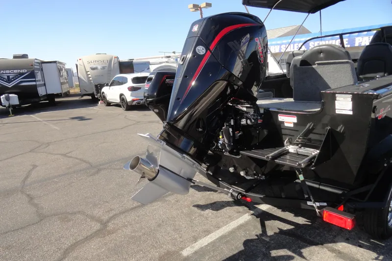 Slide: The Image of 2022 Tracker Targa V-19 Combo boat with powerful outboard motor in parking lot. - 28
