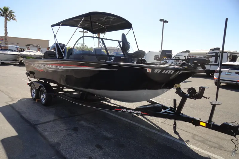 Slide: The Image of 2022 Tracker Targa V-19 Combo boat on trailer in parking lot. - 3