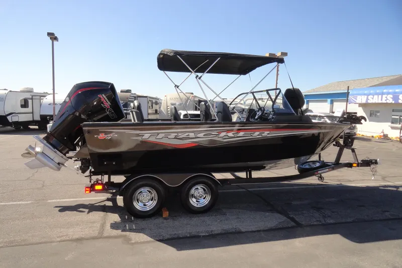 Slide: The Image of 2022 Tracker Targa V-19 Combo boat on trailer, parked outdoors. - 4