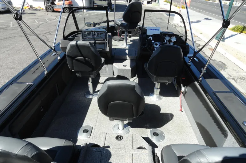 Slide: The Image of 2022 Tracker Targa V-19 Combo boat interior with seating and dashboard view. - 5
