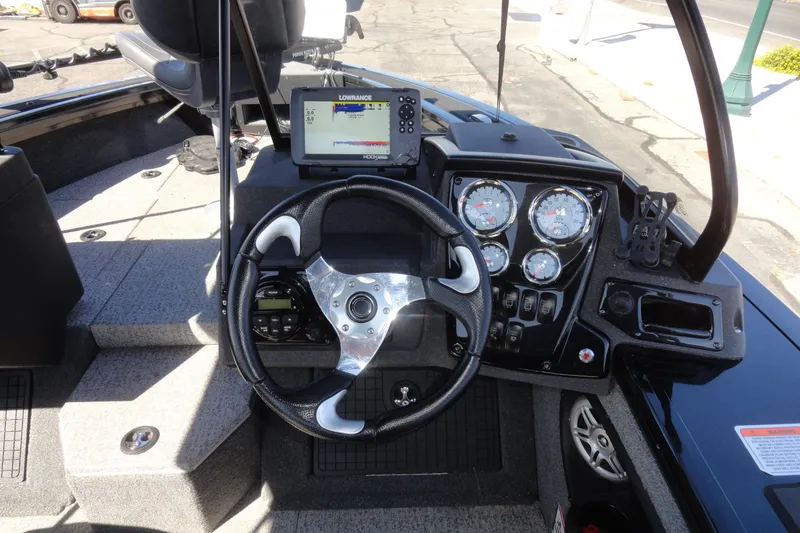 Slide: The Image of 2022 Tracker Targa V-19 Combo boat dashboard with steering wheel and Lowrance fishfinder. - 7