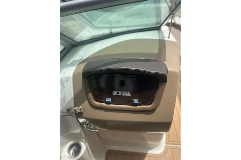 Slide: The Image of 2015 Chaparral 264 Sunesta boat dashboard with Sunesta logo and windshield. - 15