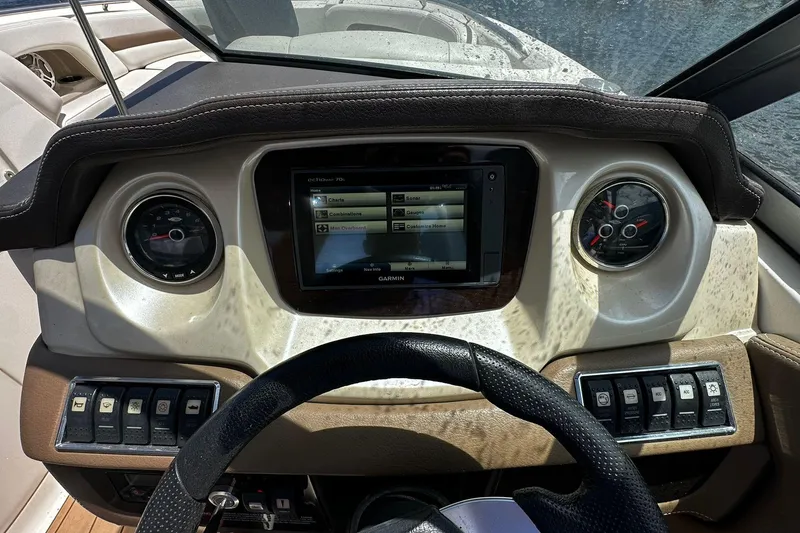 Slide: The Image of Dashboard of a 2015 Chaparral 264 Sunesta boat with Garmin navigation system. - 26