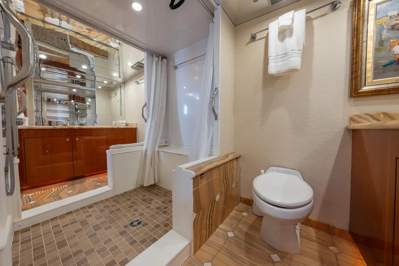 Slide: The Image of Luxurious bathroom on 2004 Hatteras 75 Sport Deck Motor Yacht with shower and elegant fixtures. - 15