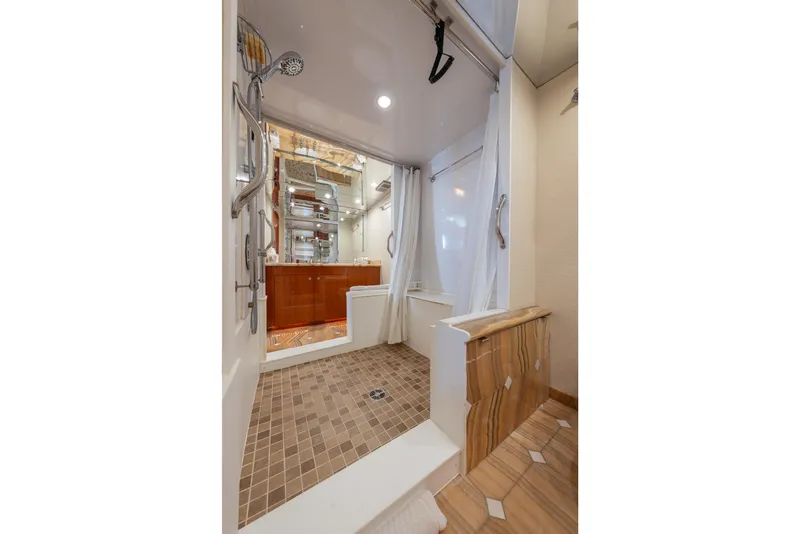 Slide: The Image of Luxurious bathroom interior of 2004 Hatteras 75 Sport Deck Motor Yacht with modern fixtures. - 16