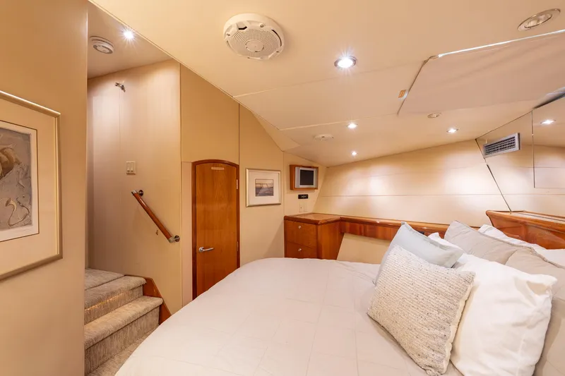 Slide: The Image of Luxurious bedroom interior of 2004 Hatteras 75 Sport Deck Motor Yacht with elegant decor. - 23