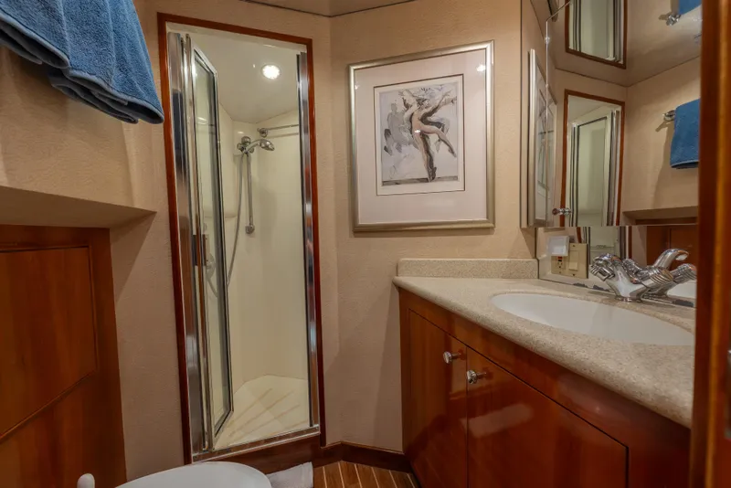 Slide: The Image of Luxurious bathroom on 2004 Hatteras 75 Sport Deck Motor Yacht with shower and elegant fixtures. - 27
