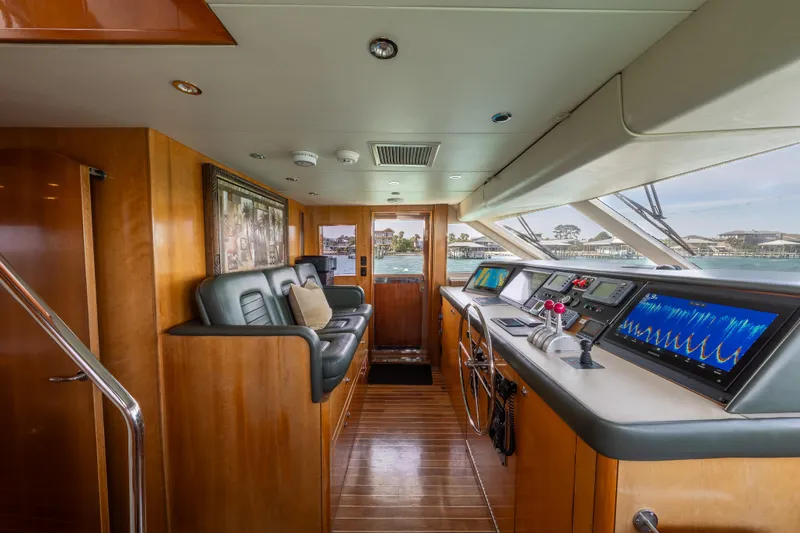 Slide: The Image of Luxurious helm of 2004 Hatteras 75 Sport Deck Motor Yacht with advanced navigation systems. - 28