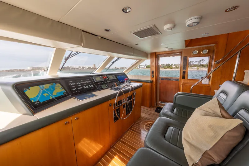Slide: The Image of Luxurious helm of 2004 Hatteras 75 Sport Deck Motor Yacht with modern navigation systems. - 30