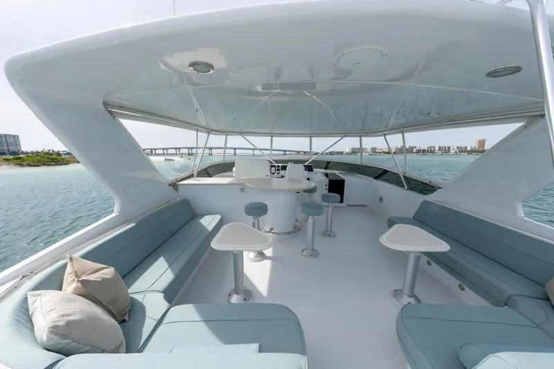 Slide: The Image of Luxurious 2004 Hatteras 75 Sport Deck Motor Yacht with spacious seating and ocean view. - 31