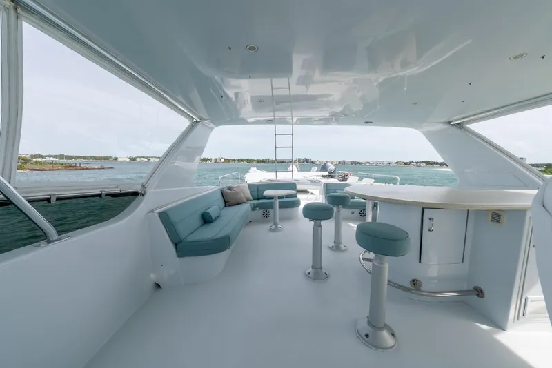 Slide: The Image of Luxurious 2004 Hatteras 75 Sport Deck Motor Yacht with spacious seating and ocean view. - 35