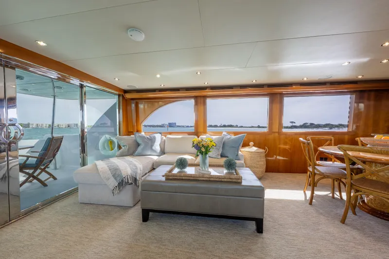 Slide: The Image of Luxurious interior of 2004 Hatteras 75 Sport Deck Motor Yacht with elegant seating and ocean views. - 4