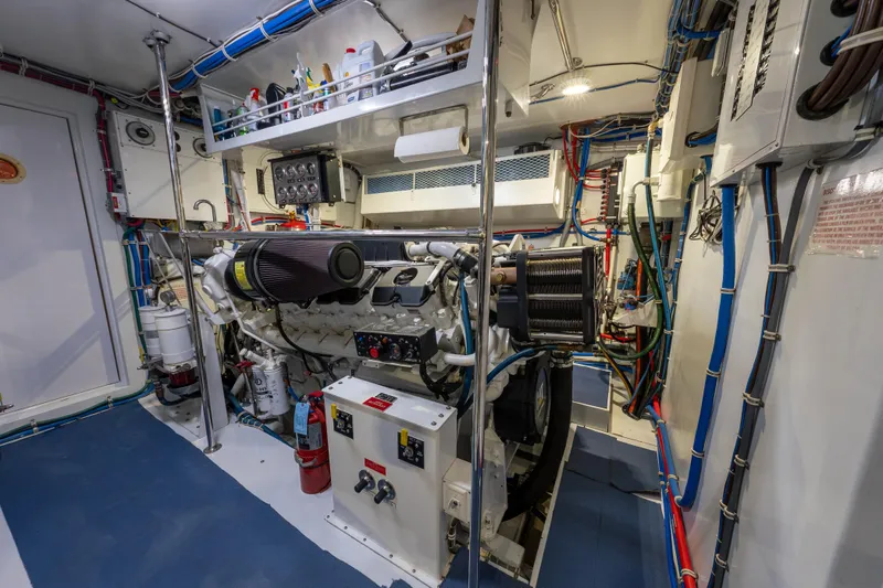Slide: The Image of Engine room of 2004 Hatteras 75 Sport Deck Motor Yacht, showcasing machinery and wiring. - 45