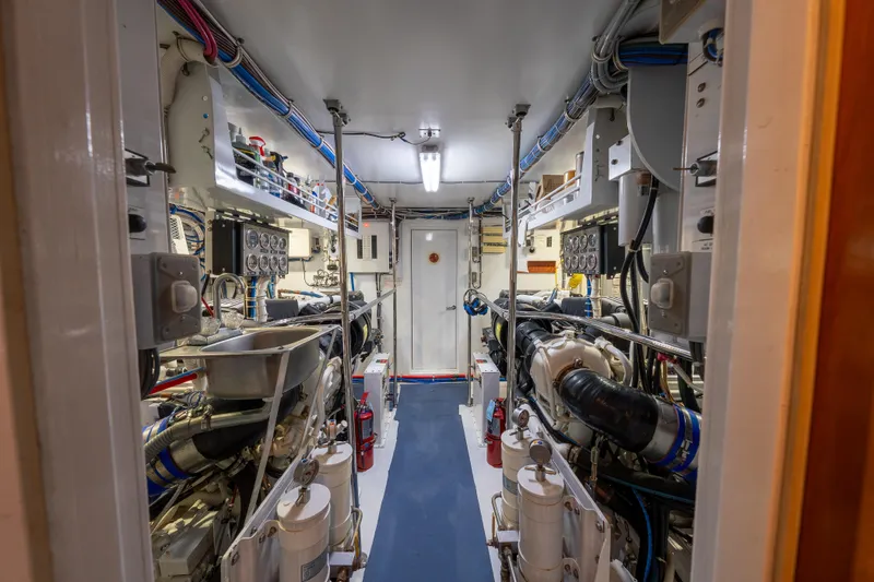 Slide: The Image of Engine room of 2004 Hatteras 75 Sport Deck Motor Yacht, showcasing machinery and equipment. - 47