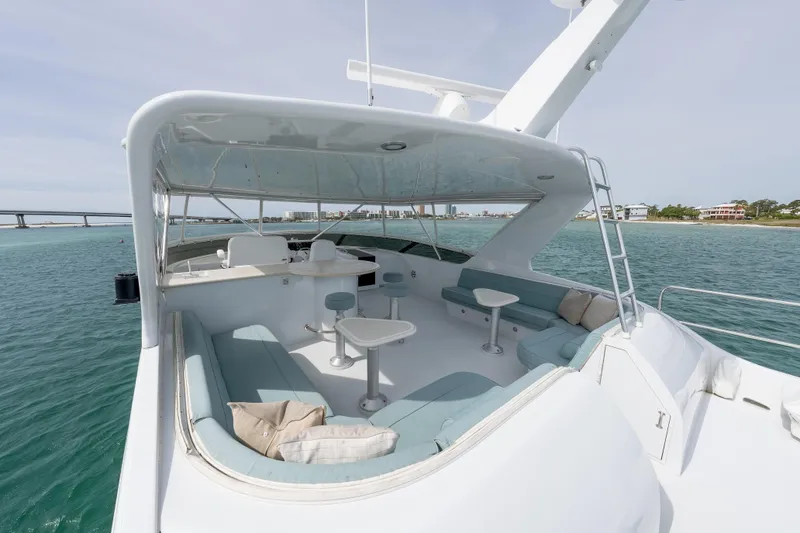 Slide: The Image of Luxurious 2004 Hatteras 75 Sport Deck Motor Yacht with spacious outdoor seating area. - 58