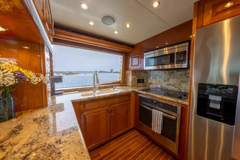 Slide: The Image of Luxurious kitchen interior of 2004 Hatteras 75 Sport Deck Motor Yacht with ocean view. - 6