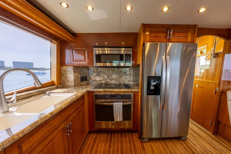 Slide: The Image of Luxurious kitchen interior of 2004 Hatteras 75 Sport Deck Motor Yacht with modern appliances. - 7