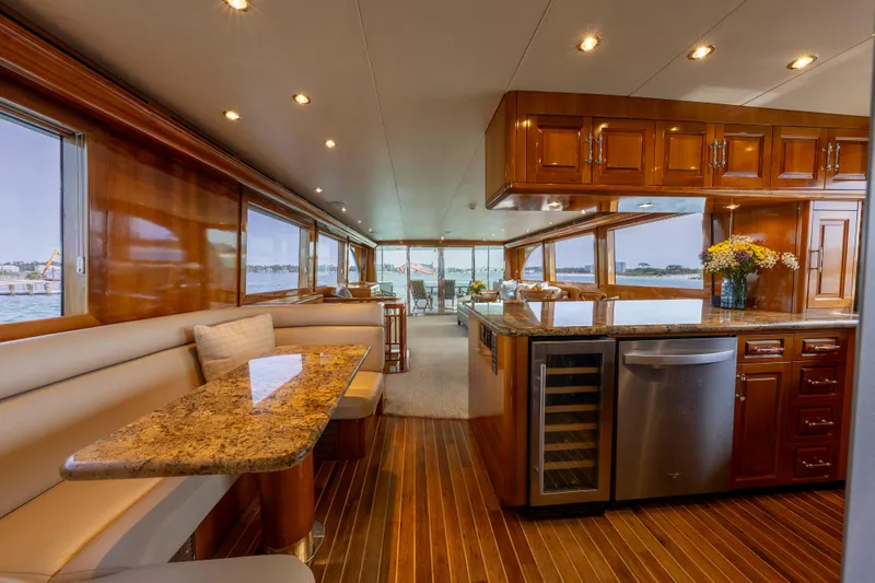 Slide: The Image of Luxurious interior of 2004 Hatteras 75 Sport Deck Motor Yacht with elegant wood finishes. - 9