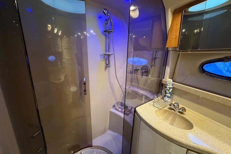 Slide: The Image of Luxurious bathroom in 2002 Regal Commodore 3860 yacht with modern fixtures and elegant design. - 28