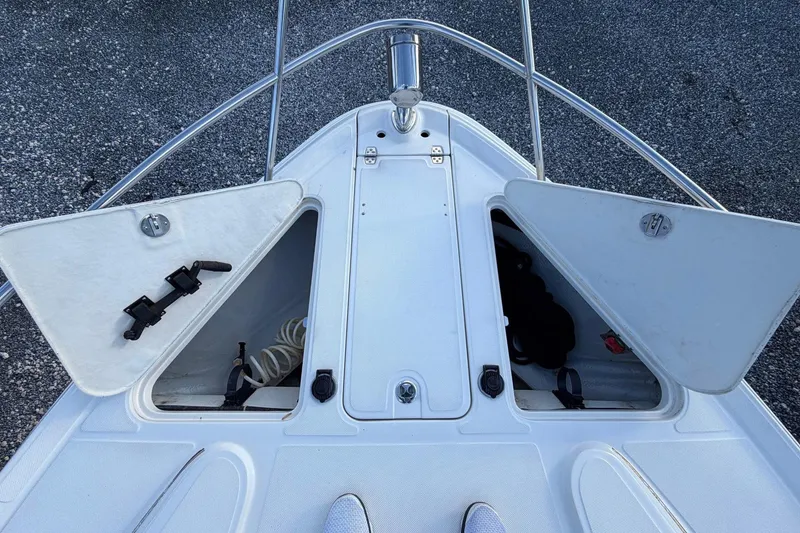 Slide: The Image of Bow storage compartments on a 2002 Regal Commodore 3860 boat, open and accessible. - 19