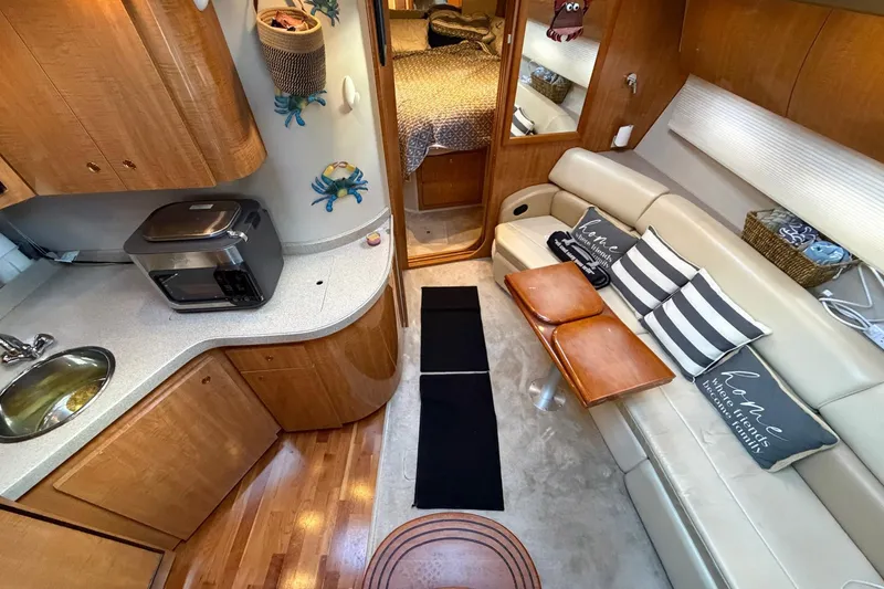 Slide: The Image of Luxurious interior of 2002 Regal Commodore 3860 yacht with modern amenities and cozy seating. - 23