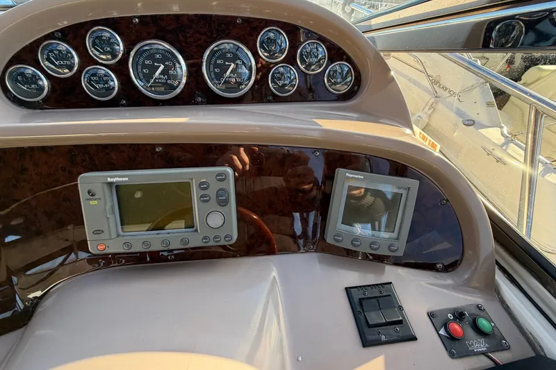 Slide: The Image of 2002 Regal Commodore 3860 dashboard with gauges and navigation equipment. - 14