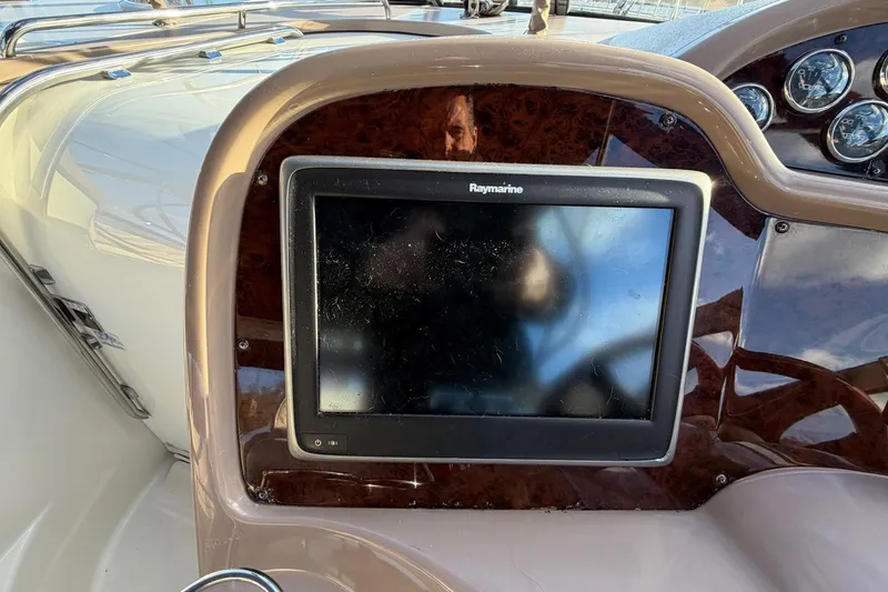 Slide: The Image of Dashboard of 2002 Regal Commodore 3860 with Raymarine navigation display. - 15