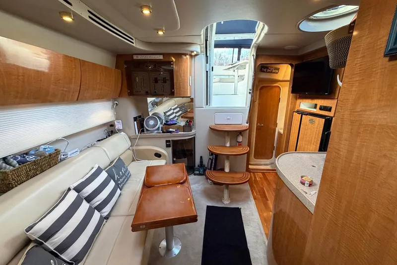 Slide: The Image of Interior of 2002 Regal Commodore 3860 yacht with modern amenities and wooden finishes. - 29