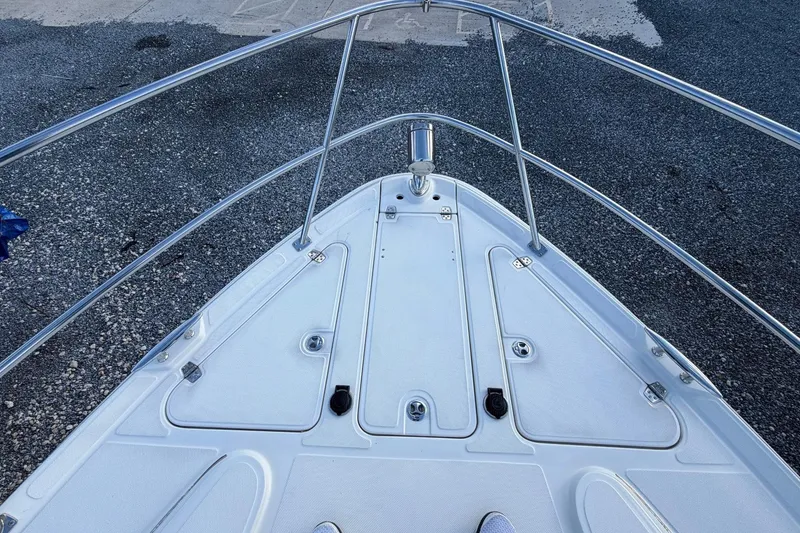 Slide: The Image of Bow of 2002 Regal Commodore 3860 boat with stainless steel railings. - 17